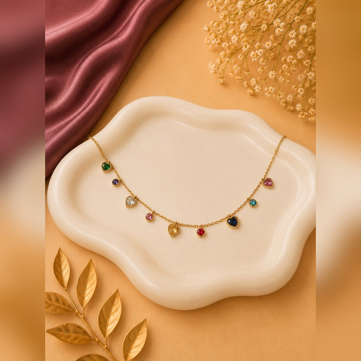 Gold chain necklace with alternating heart and round multicolour stone stations