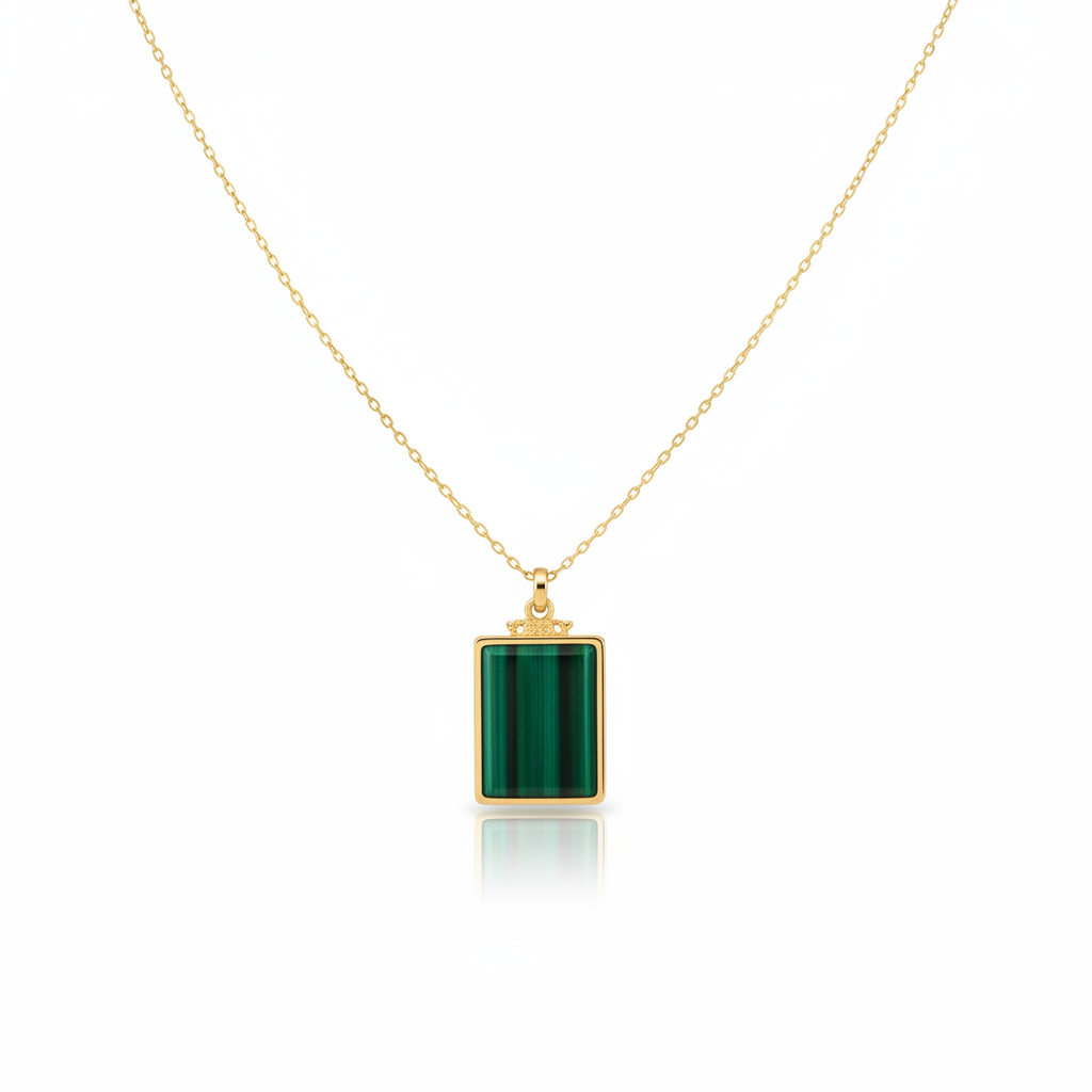 Gold cable chain malachite rectangle pendant necklace on pure white background studio photography