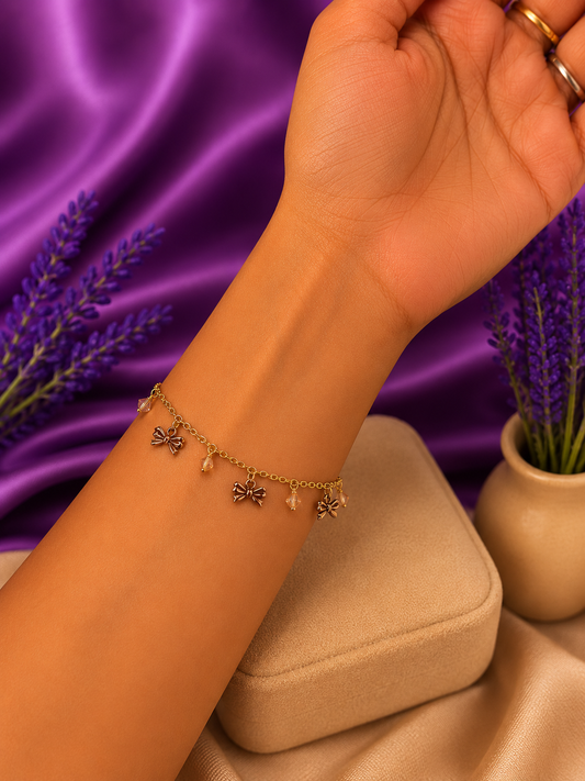 Gold Bow Charm Bracelet with Crystal Drops