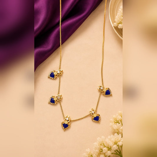 Gold chain necklace with dark-blue enamel heart charms and crystal flower connectors