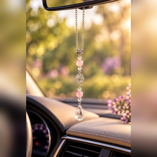 Pink crystal car charm with soft pink beads, silver flower charm and clear teardrop crystal, hanging from a rearview mirror
