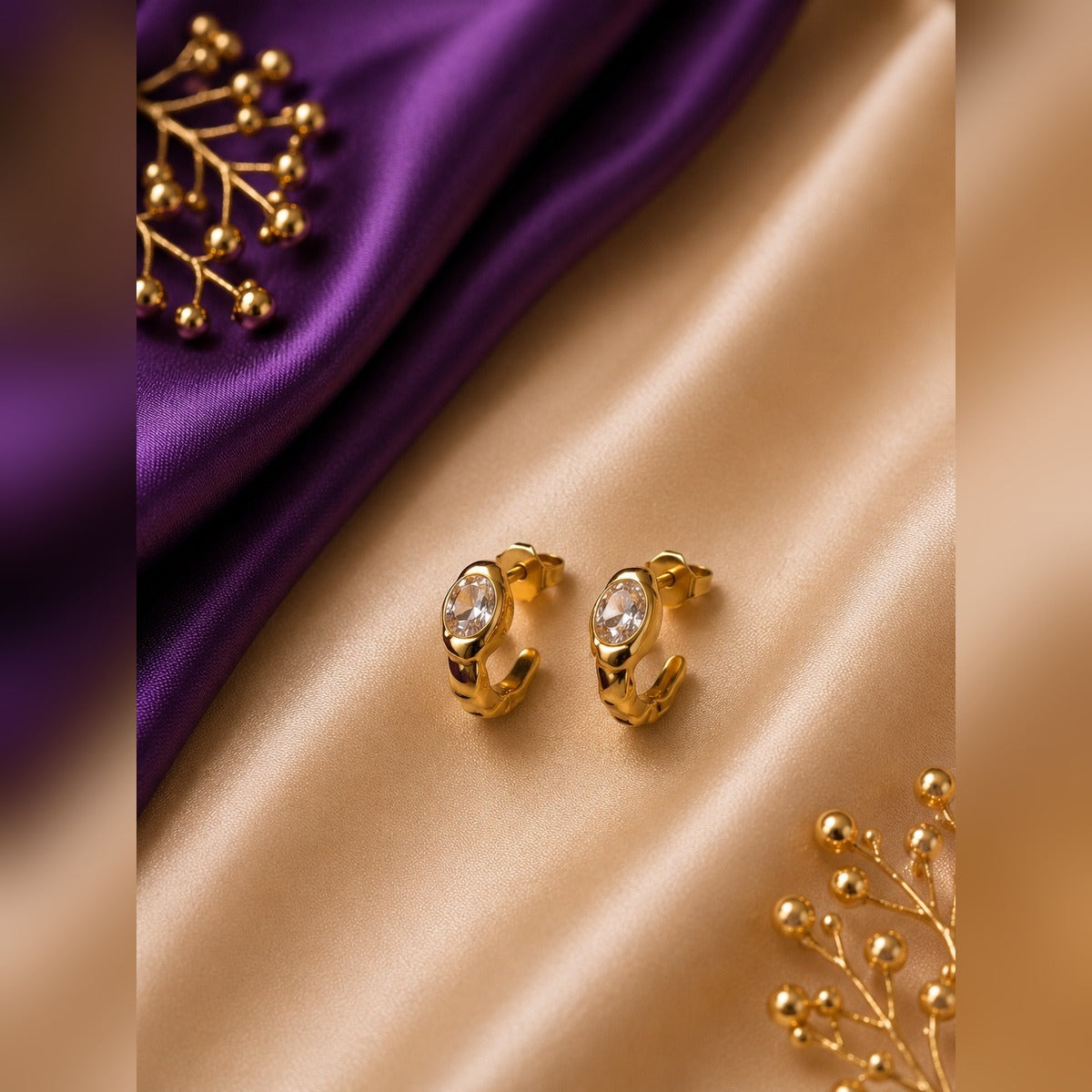 Gold J-hook stud earrings with an oval clear crystal, anti-tarnish