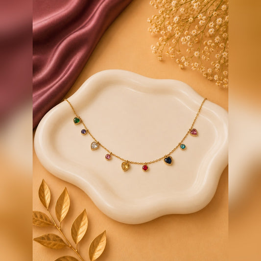 Gold chain necklace with alternating heart and round multicolour stone stations