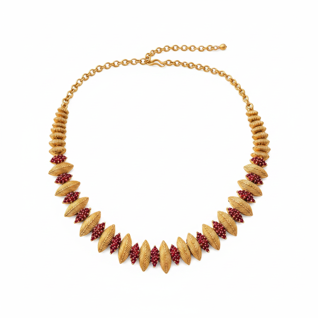 Gold textured feather leaf and ruby seed bead necklace on pure white background studio photography