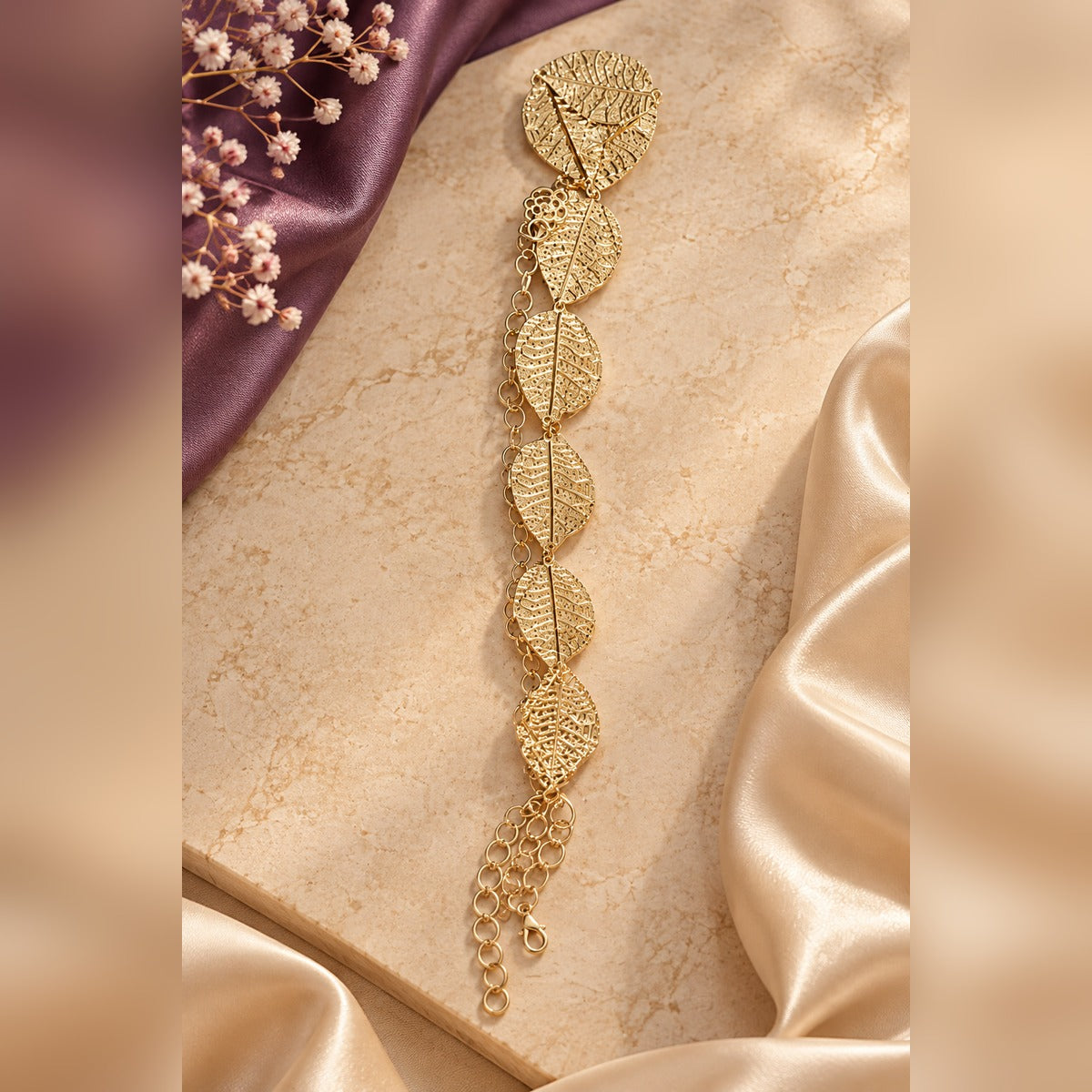 Gold leaf filigree waist band with six large leaf stations on a fine chain, lobster clasp and extender