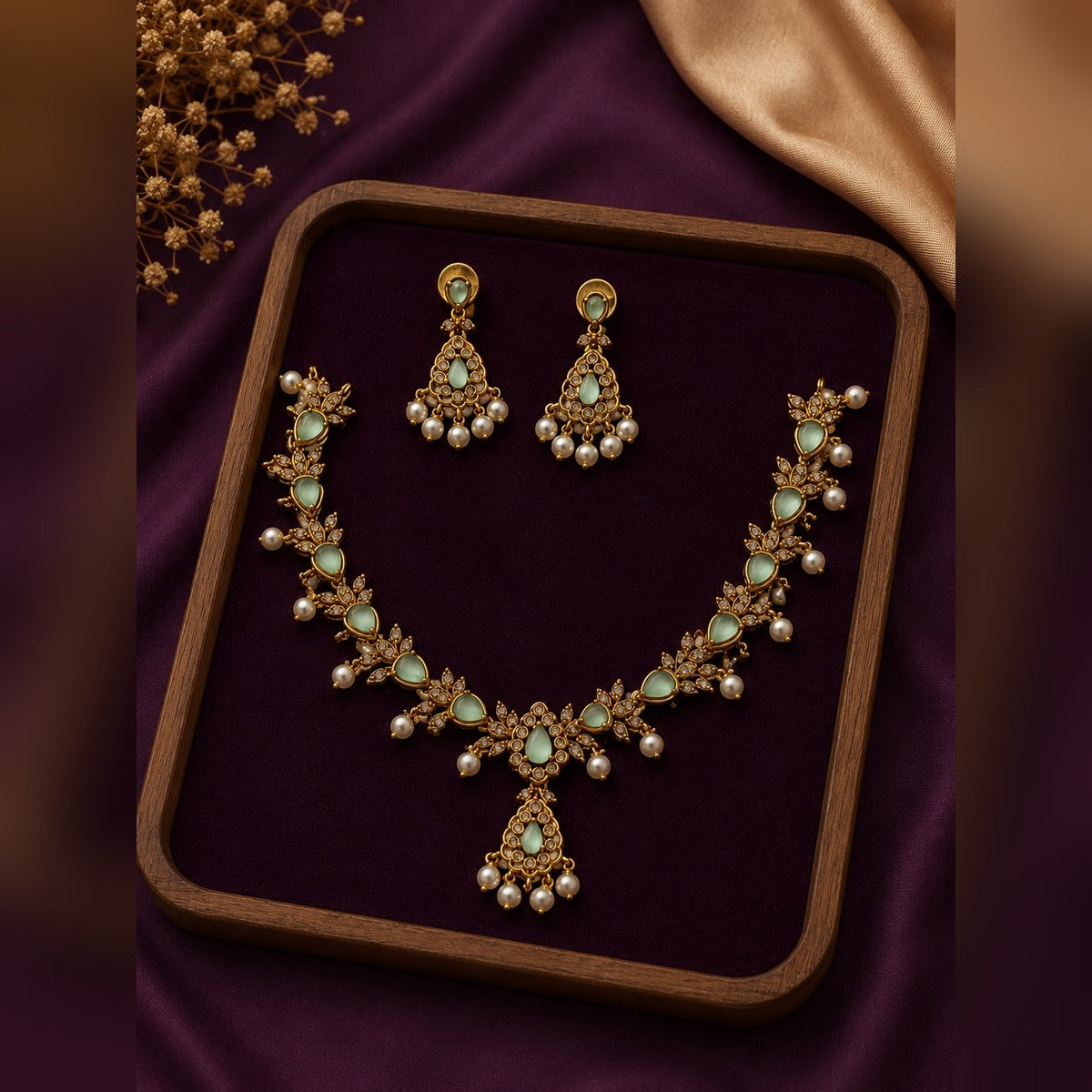Gold necklace and earring set with mint teardrop stones, crystal leaves and pearl drops