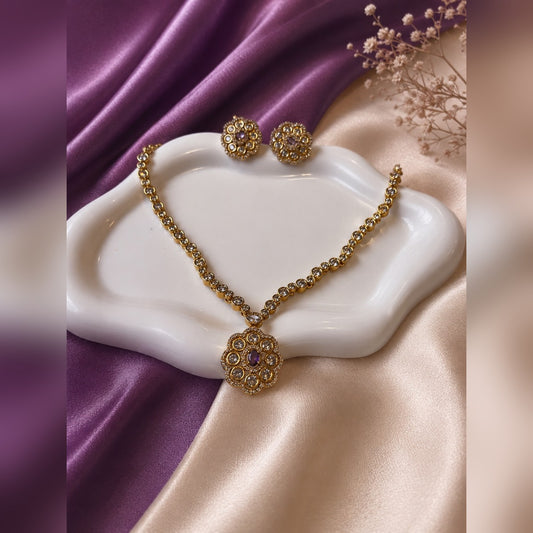 Crystal tennis necklace with purple-centre flower pendant and matching flower studs