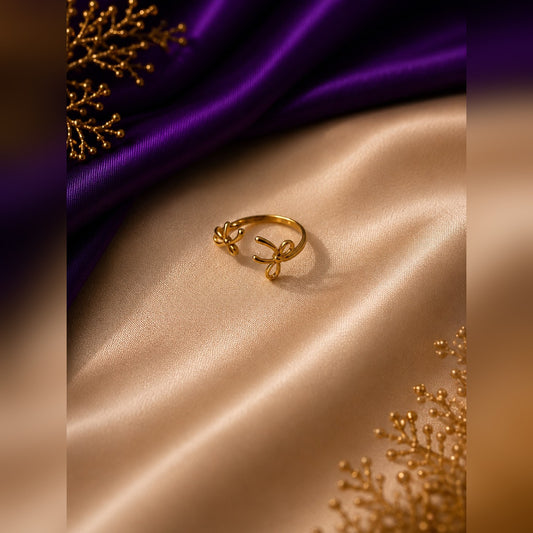 Gold open ring with two small bows