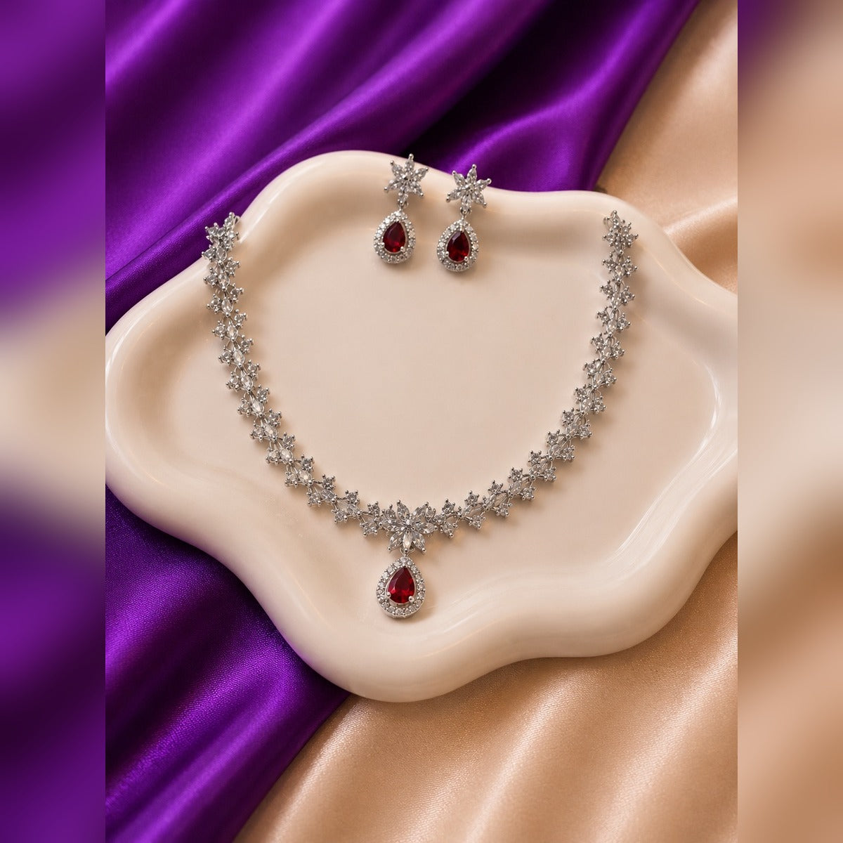 Silver-tone crystal-link necklace with crystal flower and ruby teardrop pendant and star earrings