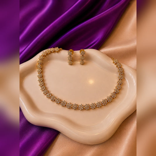 Crystal star-link necklace with three-star drop earrings