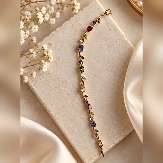 Gold wavy vine bracelet with multicolour oval and marquise stones